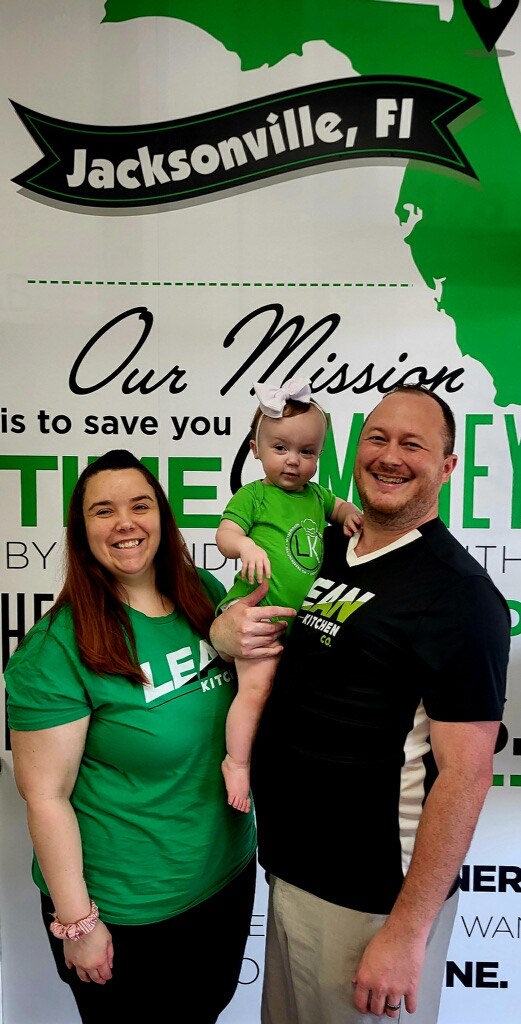 Lean Kitchen Co. Jacksonville, Florida store owners Shane and Lora Weeks and their child.